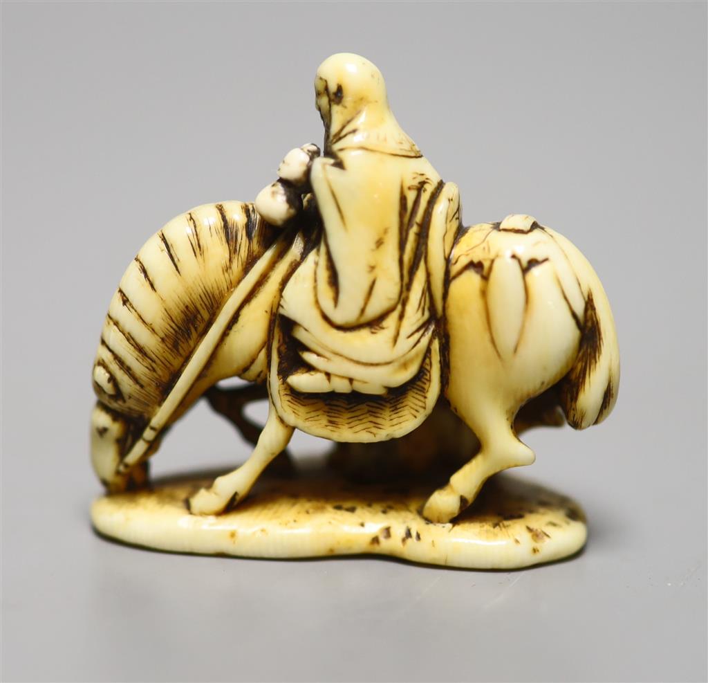 A 19th century ivory netsuke horse group, height 4cm, three character signature